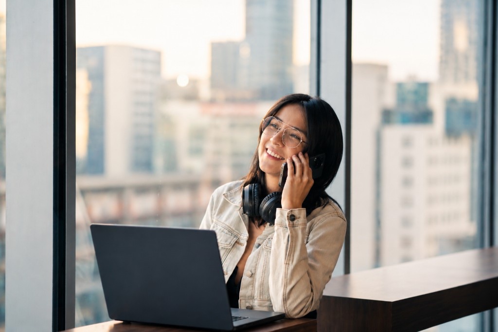 Professional learner using laptop and phone